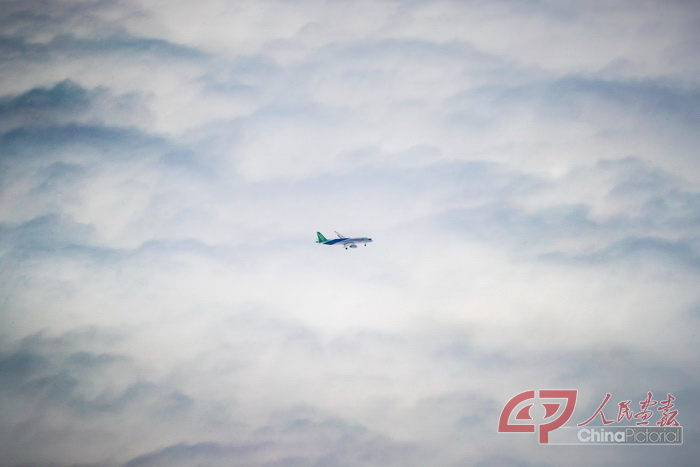 May 5, 2017: The C919 flies high in the clouds. The C919 is a single-aisle commercial aircraft built for medium-haul flights,  with up to 174 seats and twin engines. by Wan Quan/China Pictorial