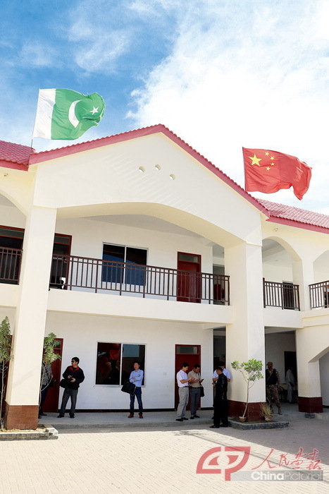 The national flags of China and Pakistan fly atop the teaching building at the China-Pakistan Goverment Primary School in Faqeer Colony, Gwadar